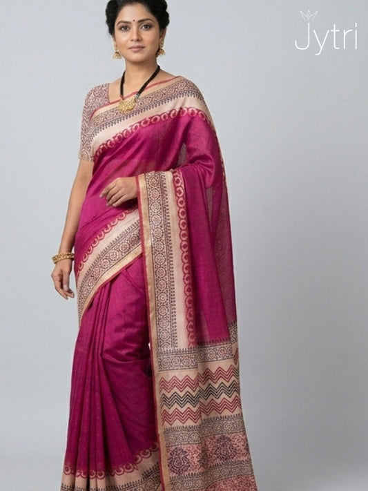 Woman wearing dusty rose Katan staple saree with Jaipuri hand block print pallu