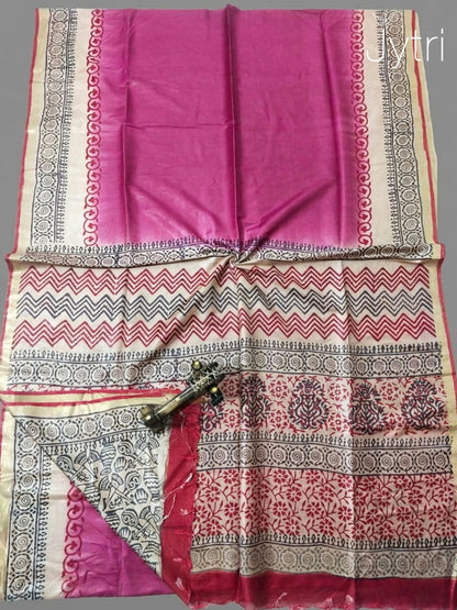Elegant dusty rose printed saree with traditional block print border and soft drape