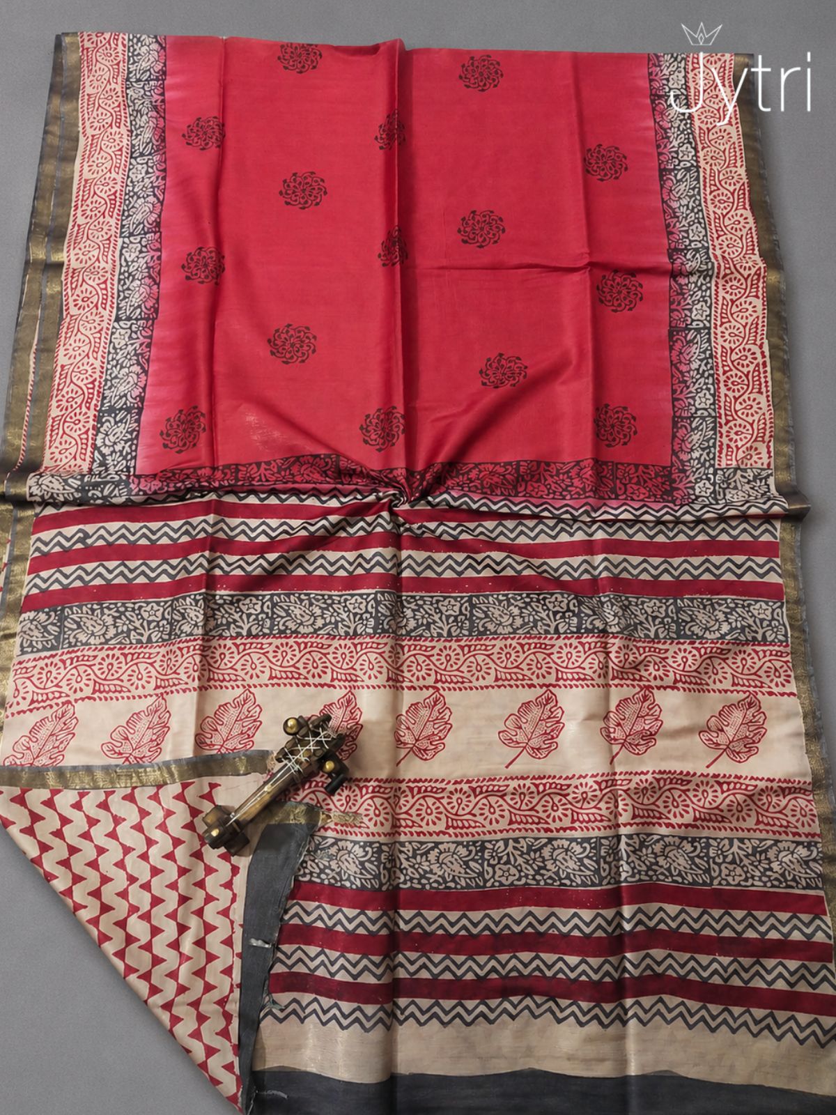 Elegant red printed saree with traditional block print border and designer pallu
