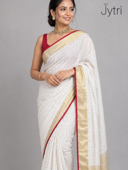 Woman wearing off white slub cotton saree with zari box pattern and red border