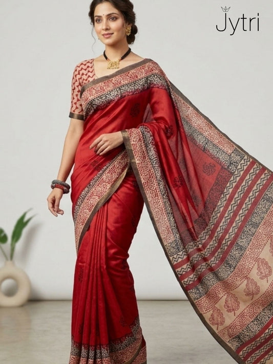 Woman wearing red Katan staple saree with Jaipuri hand block print and detailed pallu