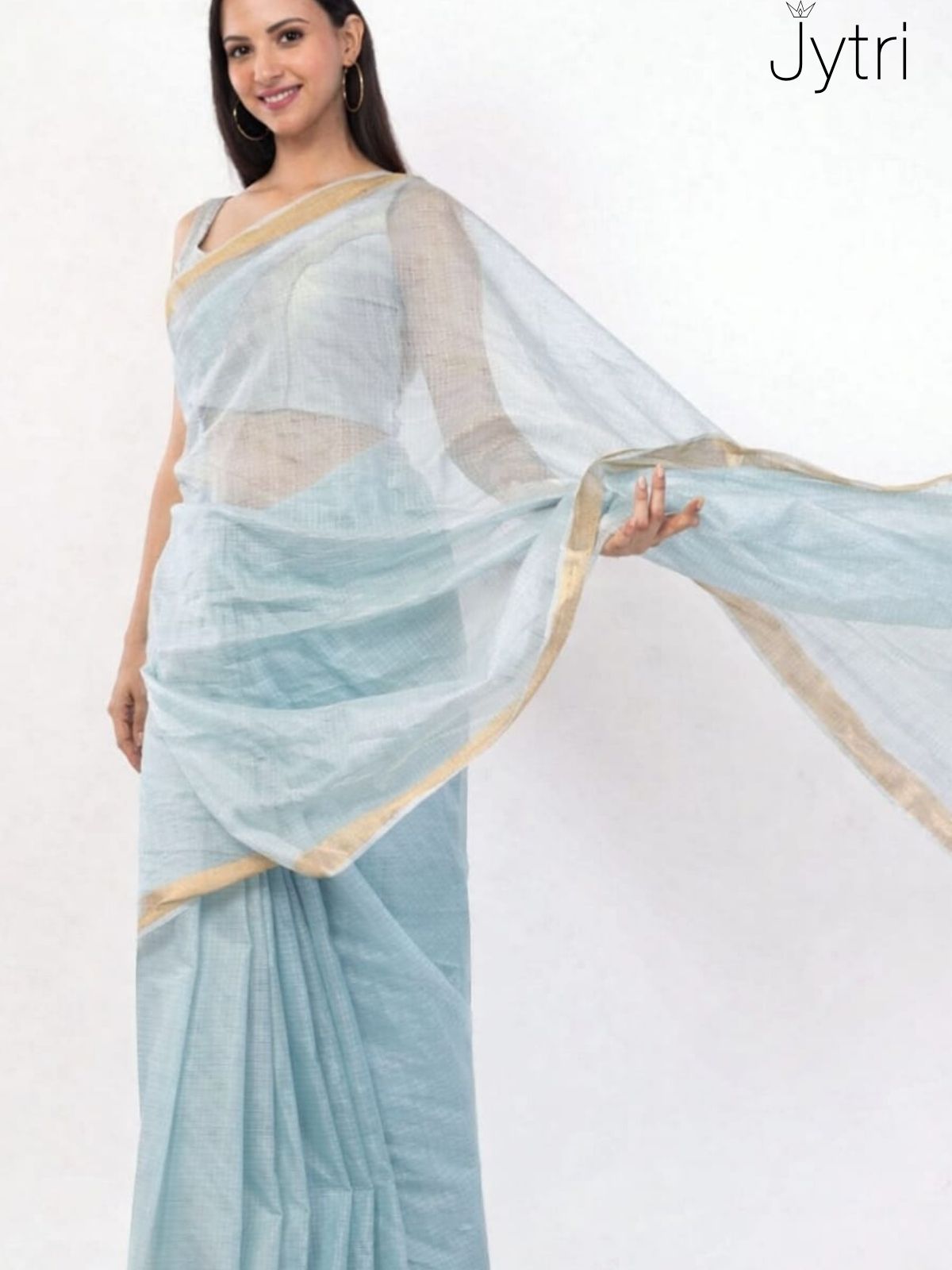Woman wearing sky blue Kota Doria saree with golden border and sheer pallu