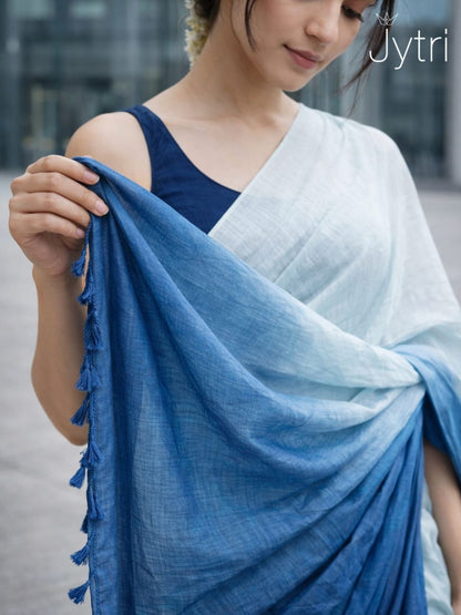 Woman holding a blue dual tone saree